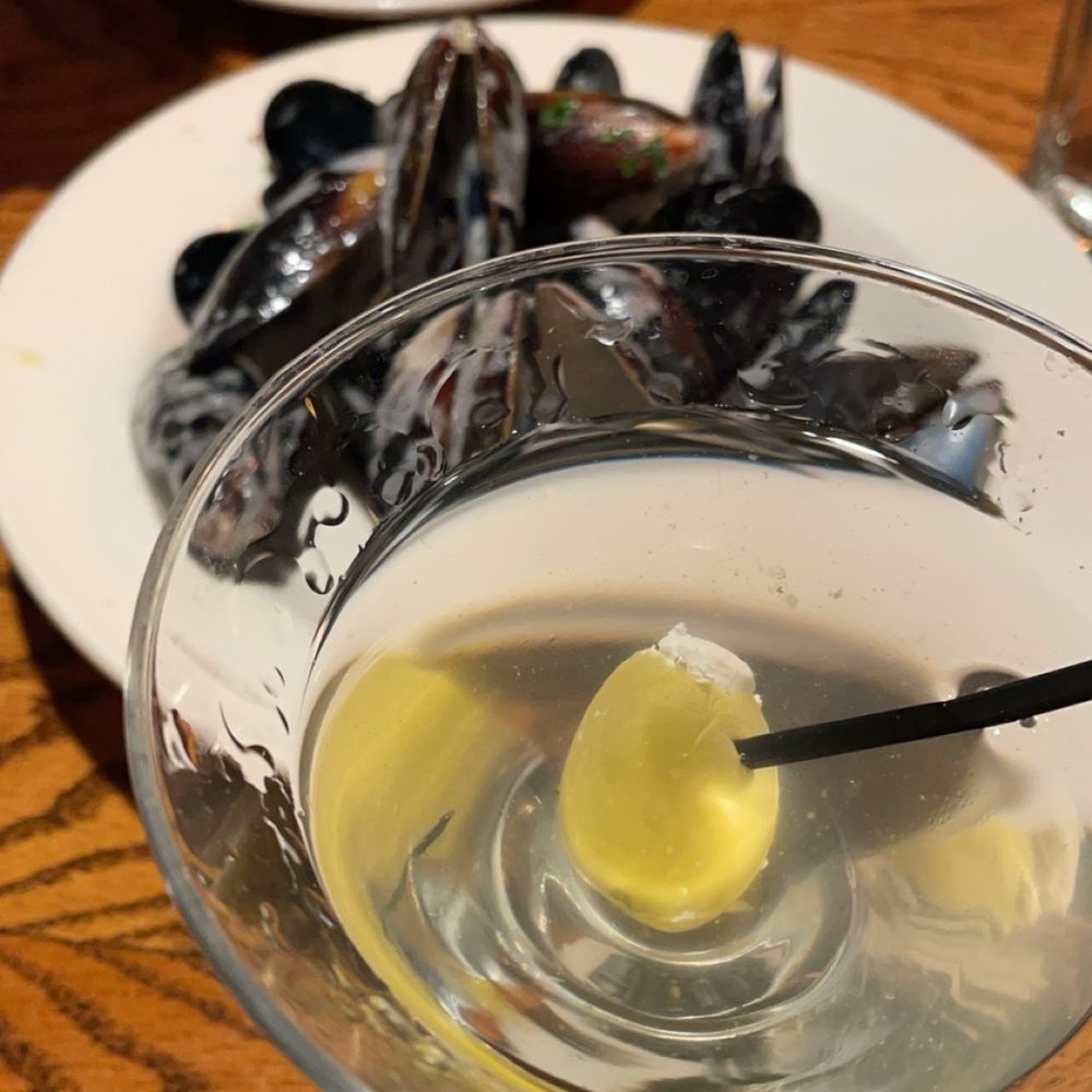 Mussels and a dirty gin martini with blue cheese olive. Mussels and a dirty gin martini with blue cheese olive.