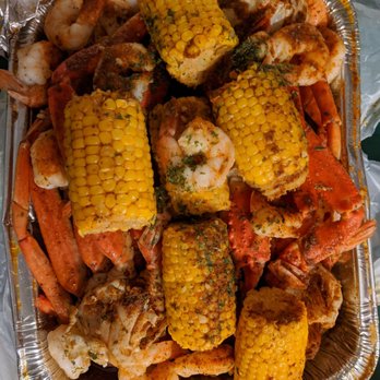 Kings Fish and Wings - a tray of seafood and corn - Seafood Near Me - Union City, Georgia Kings Fish and Wings - a tray of seafood and corn - Seafood Near Me - Union City, Georgia