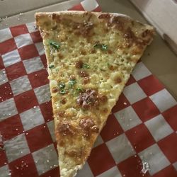 Crush Pizza And Wine - White garlic pizza slice