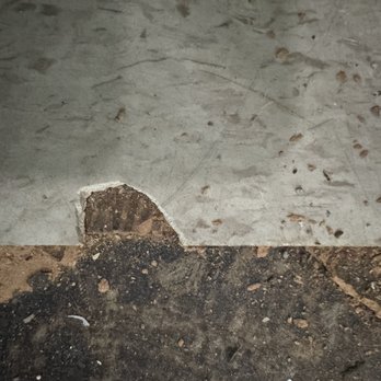 Woods Basement Systems - Broken floor tile - Waterproofing Near Me - Collinsville, Illinois