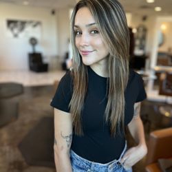 Avera Salon - Warm chocolate brown with 90s highlights long face framing layers.