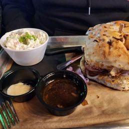 Beefy sandwich with au jus and smoked potato salad