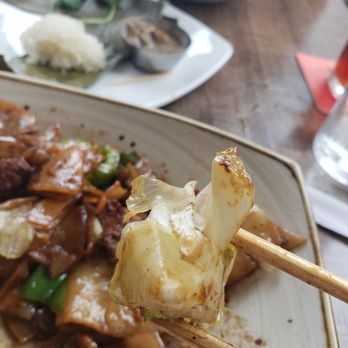 Malai Kitchen - Drunken Noodles with a side of lettuce core - Thai Near Me - Dallas, Texas Malai Kitchen - Drunken Noodles with a side of lettuce core - Thai Near Me - Dallas, Texas