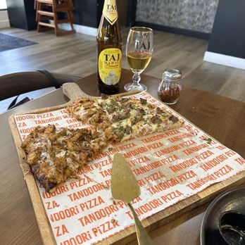 Tandoori Pizza - The remaining pieces of the two selections of pizza. - Indian Near Me - Clovis, California Tandoori Pizza - The remaining pieces of the two selections of pizza. - Indian Near Me - Clovis, California