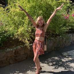a woman with her arms outstretched in the air
