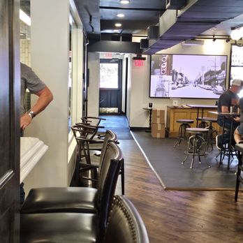 Stable Reserve Distillery - a man standing at a bar - Cocktail Bars Near Me - Franklin, Tennessee