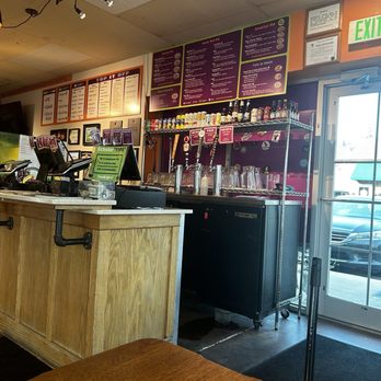 Infinitus Pie - Shot of the counter where you order and decent beer selection - Pizza Near Me - Broomfield, Colorado