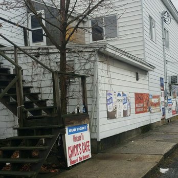 Chicks Cafe - a white building with signs on the side of the building - Bars Near Me - Gordon, Pennsylvania