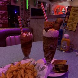 Chocolate dipped strawberry shake, s'mores shake, and fries Chocolate dipped strawberry shake, s'mores shake, and fries