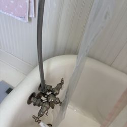 Vintage Tub & Bath - The neck attached to the faucets is CURVED at an angle so the shower rod cannot stand straight up (like they did for only about 100 years)