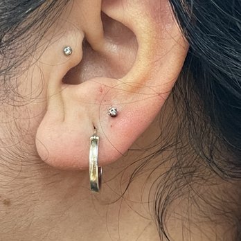 Coy Fish Tattoo - Lobe piercing by Danny - Tattoo Near Me - Los Angeles, California