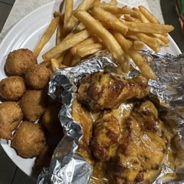 Honey hot wings, fries, and Jalapeño hush puppies Honey hot wings, fries, and Jalapeño hush puppies