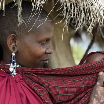 Bush Signature - Maasai First Wife (of three) and her 2 month old infant - Tours Near Me Bush Signature - Maasai First Wife (of three) and her 2 month old infant - Tours Near Me