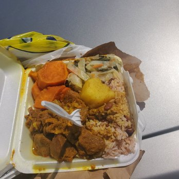 Top Taste - a tray of food on a table - Caribbean Near Me - Philadelphia, Pennsylvania