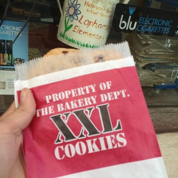 Madison Food Mart - a person holding a bag of cookies - Grocery Near Me - Madison, Wisconsin Madison Food Mart - a person holding a bag of cookies - Grocery Near Me - Madison, Wisconsin