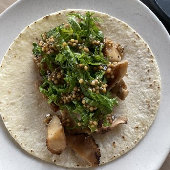Owamni - Mushroom taco with mustard leaves and seeds - New American Near Me - Minneapolis, Minnesota