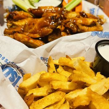 Islands Restaurant - Teriyaki Wings and truffle fries. - Burgers Near Me - Manhattan Beach, California Islands Restaurant - Teriyaki Wings and truffle fries. - Burgers Near Me - Manhattan Beach, California