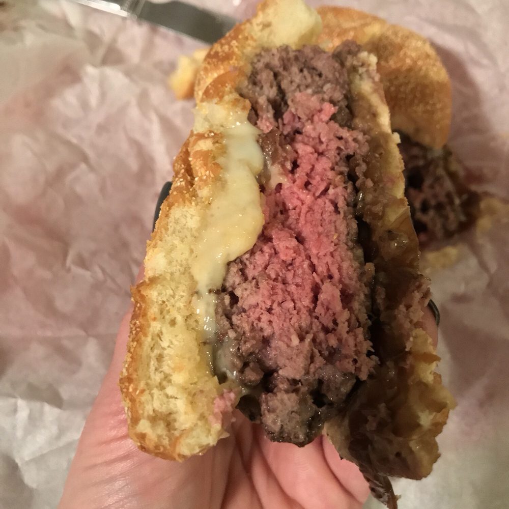 Burger too rare but even at this finish, was dry and bland. The bottom bun was completely destroyed by the caramelized onions. Burger too rare but even at this finish, was dry and bland. The bottom bun was completely destroyed by the caramelized onions.