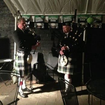 TK Irish Pub - two men in kilts playing bagpipes - Pubs Near Me - Puyallup, Washington
