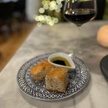 Oceano Midlothian - a plate of bread and a glass of wine - Spanish Near Me - Midlothian, Virginia Oceano Midlothian - a plate of bread and a glass of wine - Spanish Near Me - Midlothian, Virginia