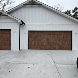 Wolfe Garage Solutions - 18x8 & 9x8 3630 design oak color.
Call us for your garage door needs.