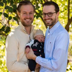 Northwest Surrogacy Center - New dads enjoying their beautiful newborn thanks to their NWSC surrogate!