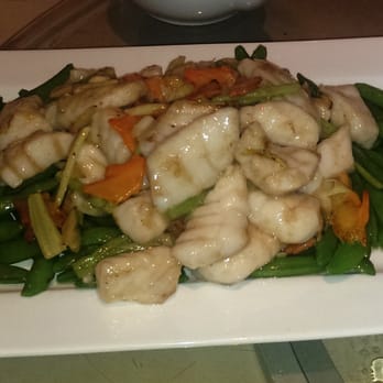 Pomelo Asian Cuisine - Stir-fried cod fillet with sugar snap beans. - Thai Near Me - Burlington, Ontario Pomelo Asian Cuisine - Stir-fried cod fillet with sugar snap beans. - Thai Near Me - Burlington, Ontario