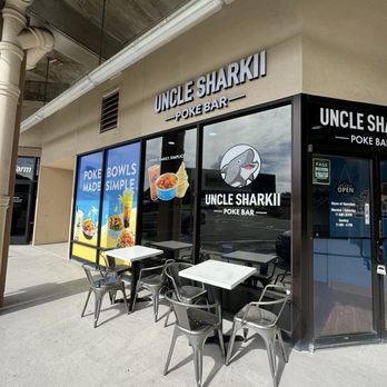 Uncle Sharkii Poke Bar - Couple seatings outside - Poke Near Me - Honolulu, Hawaii Uncle Sharkii Poke Bar - Couple seatings outside - Poke Near Me - Honolulu, Hawaii