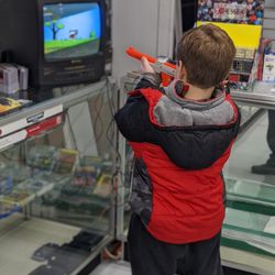 Hero City Cards & Games - Kids discovering the classics for the first time. Stop in and play some Duck Hunt on our complementary CRT setup!