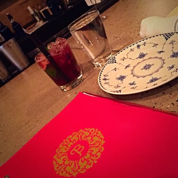 Bida Manda - Blackberry lime cocktail and their leather and wood bound menu - Laotian Near Me - Raleigh, North Carolina