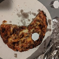 Monical's Pizza - Burnt pizza. Only ate it because I was starving and that's not extra cheese