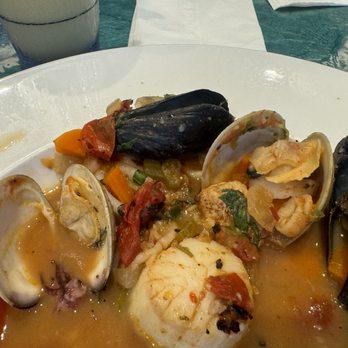 Blue Moon Beach Grill - Amazing seafood saffron vegetable broth dish with plenty of seafood! - Seafood Near Me - Nags Head, North Carolina Blue Moon Beach Grill - Amazing seafood saffron vegetable broth dish with plenty of seafood! - Seafood Near Me - Nags Head, North Carolina