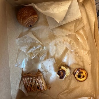 Reunion Bread - Haha crumbs of what's left  - Empanada gallega, Pain Au Chocolat,  Pastel de Nata and  Santiago's Tart. Everything was spectacular - Bakeries Near Me - Denver, Colorado
