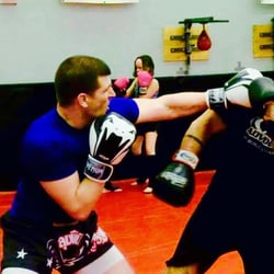 Impact Zone Training Center - Light self defense training in kickboxing basics