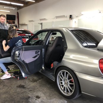 Crews Customs - Installing front driver side tint - Car Window Tinting Near Me - Hillsboro, Oregon