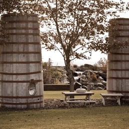 a picnic table and barrels