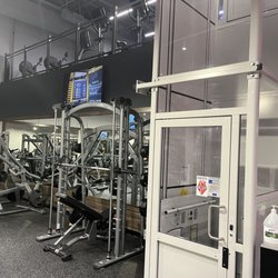 Retro Fitness - Right side of free weight area with handicapped elevator to cardio deck.