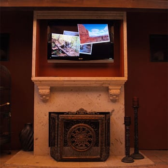 SmartHome Solutions, LLC - TV installed in custom motorized enclosure for use outdoors. Custom cantera stone paint on roller door blends right in! - Home Theatre Installation Near Me - Scottsdale, Arizona SmartHome Solutions, LLC - TV installed in custom motorized enclosure for use outdoors. Custom cantera stone paint on roller door blends right in! - Home Theatre Installation Near Me - Scottsdale, Arizona