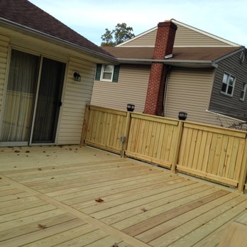Millennia Builders - a backyard with a wooden deck - General Contractors Near Me - Hatboro, Pennsylvania Millennia Builders - a backyard with a wooden deck - General Contractors Near Me - Hatboro, Pennsylvania
