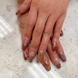 made my day today :) loving each nail having a different design esp the glass looking ones with bling