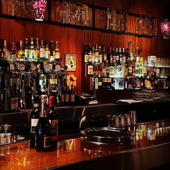 The Mark Olympia - a bar filled with bottles of alcohol - Lounges Near Me - Olympia, Washington The Mark Olympia - a bar filled with bottles of alcohol - Lounges Near Me - Olympia, Washington