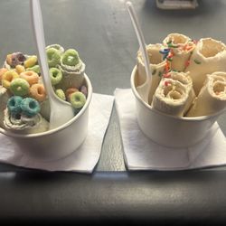 Captain crunch rolled ice cream with fruit loops cereal topping and birthday cake rolled ice cream with sprinkles.