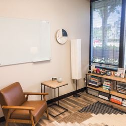 KG Psychological Services of Orange County - A warm and inviting space filled with a great white board to learn some great skills