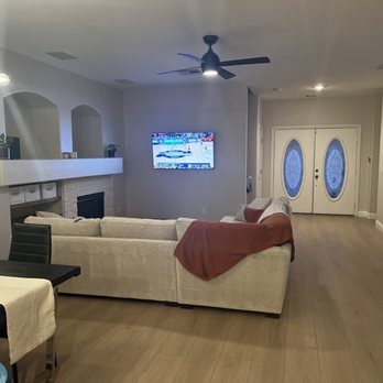 Sanchez Flooring - Fireplace, floors, lighting and added an outlet on the wall for cordless mounting! - Flooring Near Me