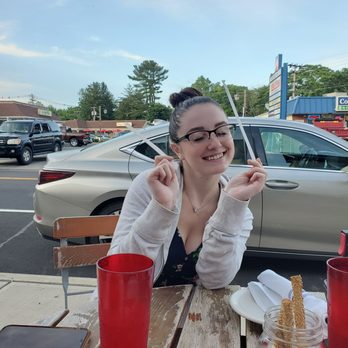 Harvest - Mini-Me enjoying her chicken Cesar salad sandwich - New American Near Me - Farmingdale, New Jersey