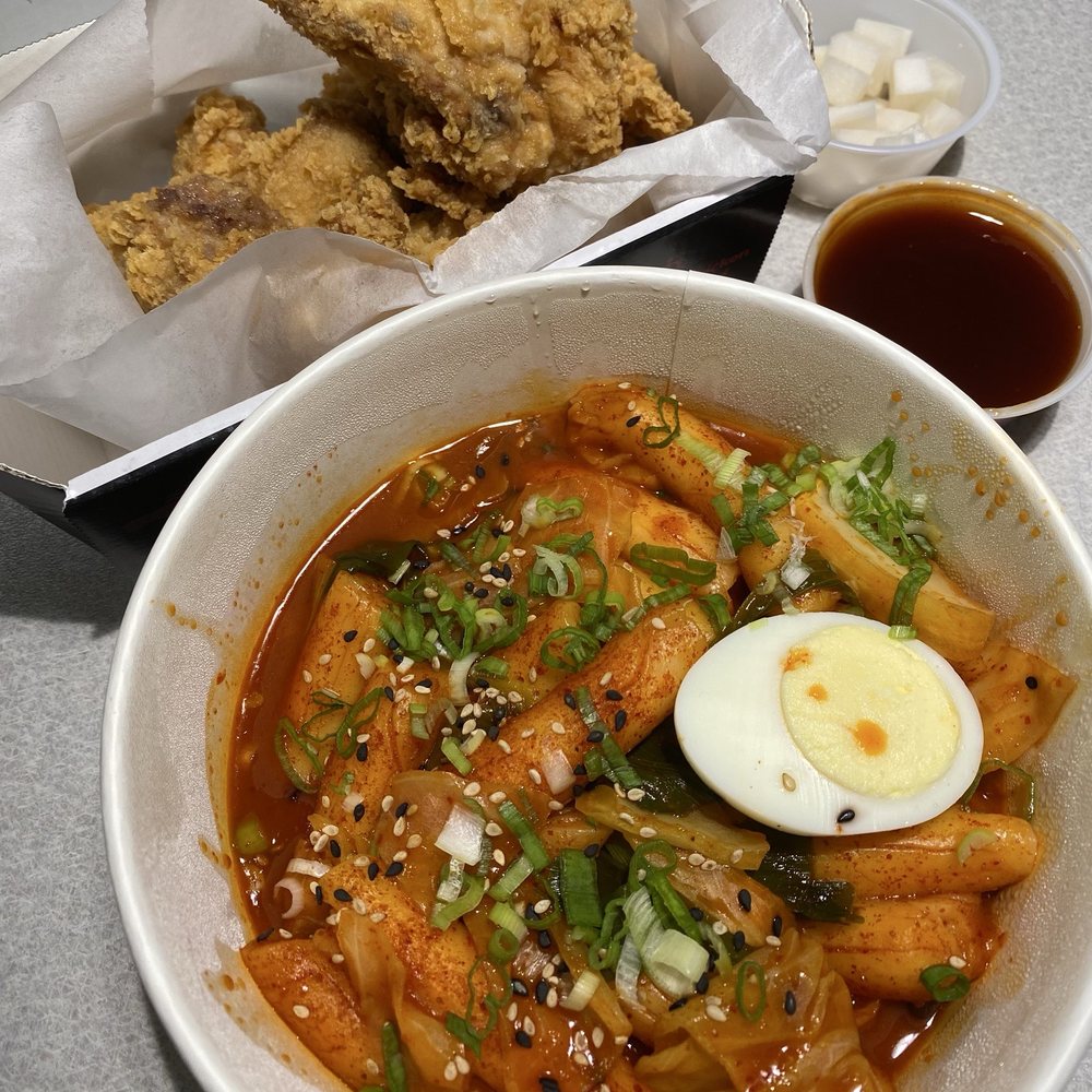 Original whole chicken with secret sauce on the side and ddeok bokki. Original whole chicken with secret sauce on the side and ddeok bokki.