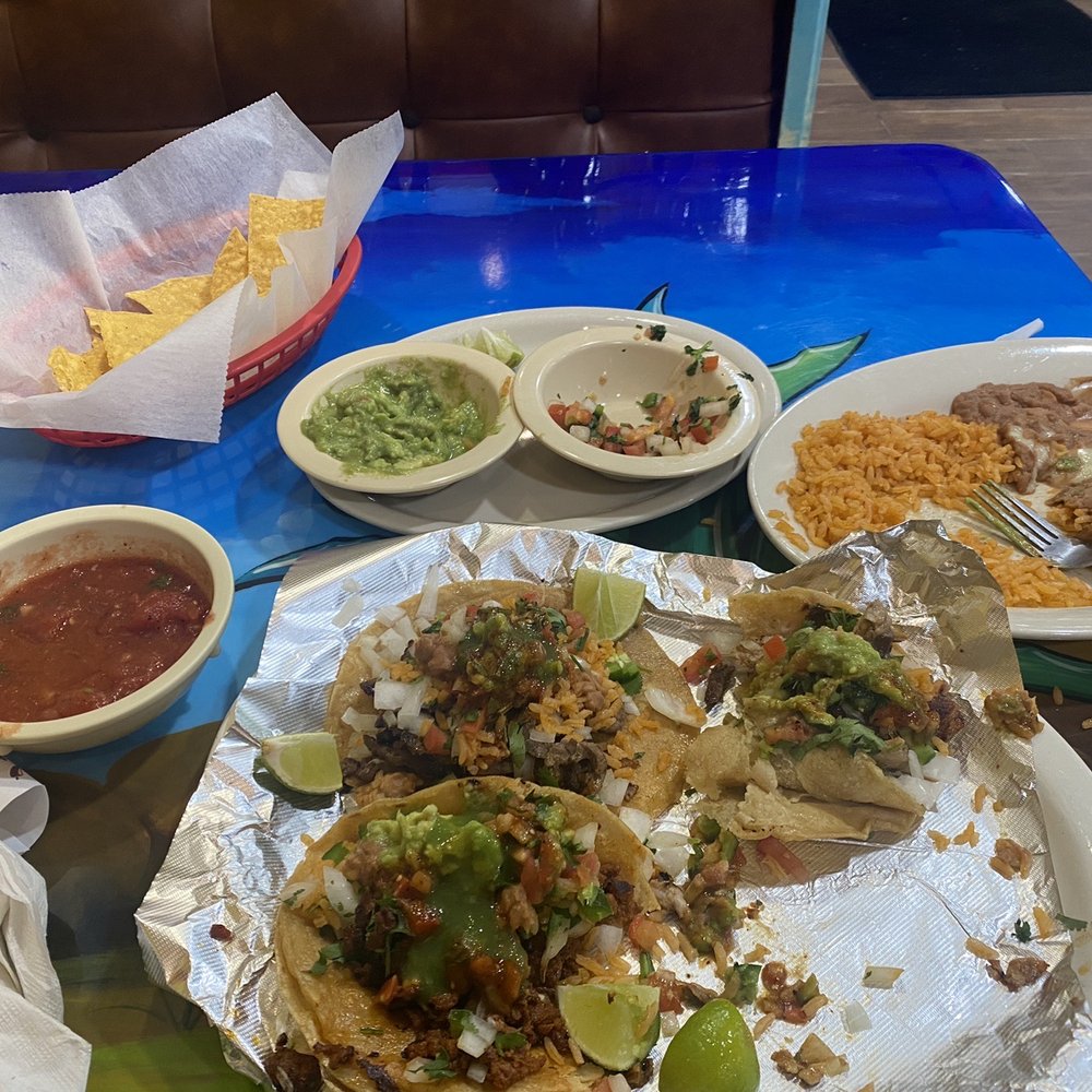 Chorizo, steak, pork tacos and rice and beans, I ate the chicken taco.... Chorizo, steak, pork tacos and rice and beans, I ate the chicken taco....