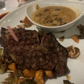 Andiamo - Rib Eye with mushroom ragu, sweet potatoes and Brussels sprouts - Italian Near Me - Warren, Michigan Andiamo - Rib Eye with mushroom ragu, sweet potatoes and Brussels sprouts - Italian Near Me - Warren, Michigan