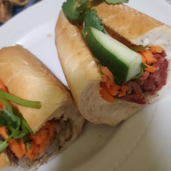 Nguyên Huong - Two halves of banh mi (other halves devoured). Chicken on the left, BBQ pork on right. FULLY LOADED. Sublime. - Vietnamese Near Me - Toronto, Ontario Nguyên Huong - Two halves of banh mi (other halves devoured). Chicken on the left, BBQ pork on right. FULLY LOADED. Sublime. - Vietnamese Near Me - Toronto, Ontario