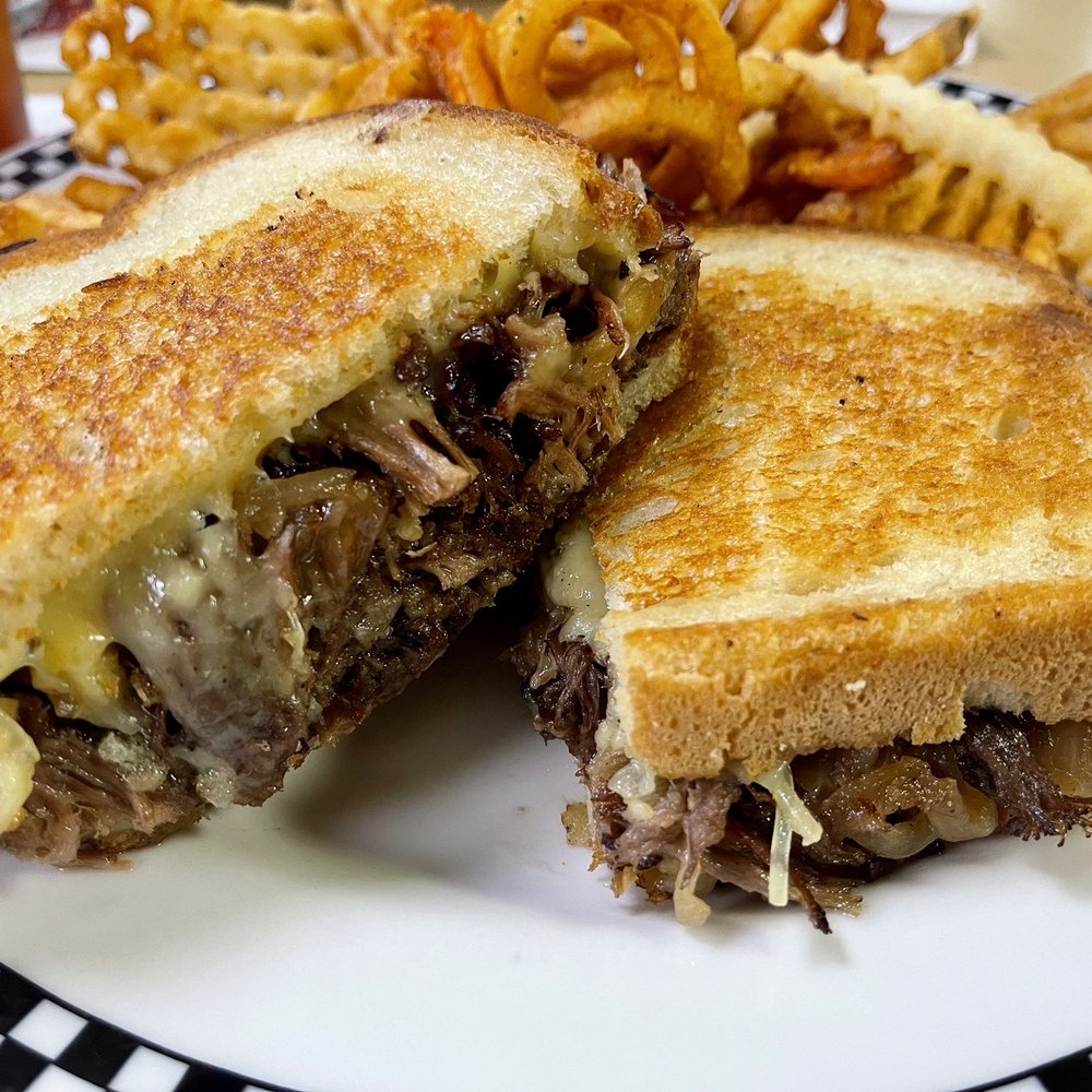 Hwy 66 Diner - Short Rib & Smoked Gouda Melt - with Caramelized Onions on Grilled Sourdough Bread. Motley Fries - American Near Me - Catoosa, Oklahoma